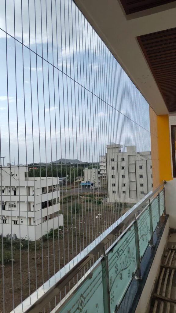 Invisible grill installation on apartment balcony